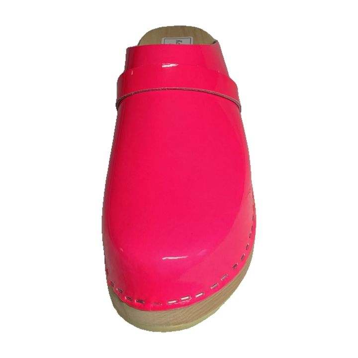 Pink patent leather clog, front three-quarter view